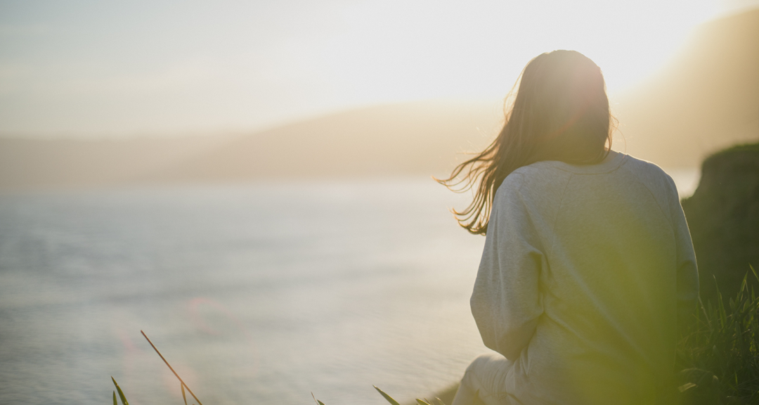 Girl Looking Out At Water